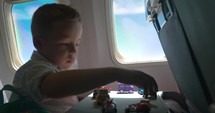 Child playing with toys during the flight