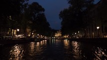 Timelapse of traveling on Amsterdam canals at night
