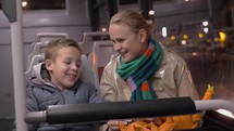 Mum and son talking when traveling by bus 