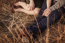 couple sitting in a field 