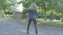 Senior school girl practising ballet on the way to school themes of ballet carefree routines education 