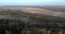 Panoramic View Of The Vast Landscape Amidst The Green Forest At The Hill. aerial