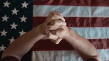 praying over an American flag 