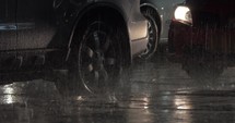 Parked cars under the rain at night
