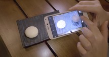 Taking picture of Mochi dessert with mobile phone