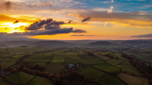 Sun setting over British countryside