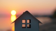 House model against the sunset