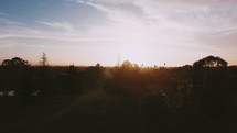 Sunset above a community | Sunset | Hope | Sunrise | Outdoors | Above | Aerial | Homes | People | World | Evangelism | Trees | Sky | Light | Park | Overhead | Pray For the City | Outreach | Vision for the City | Reach the City 