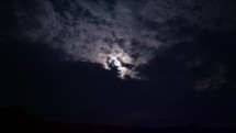 clouds moving over the moon 
