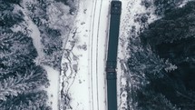 train traveling on snowy tracks 