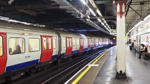 London Underground train arriving at station