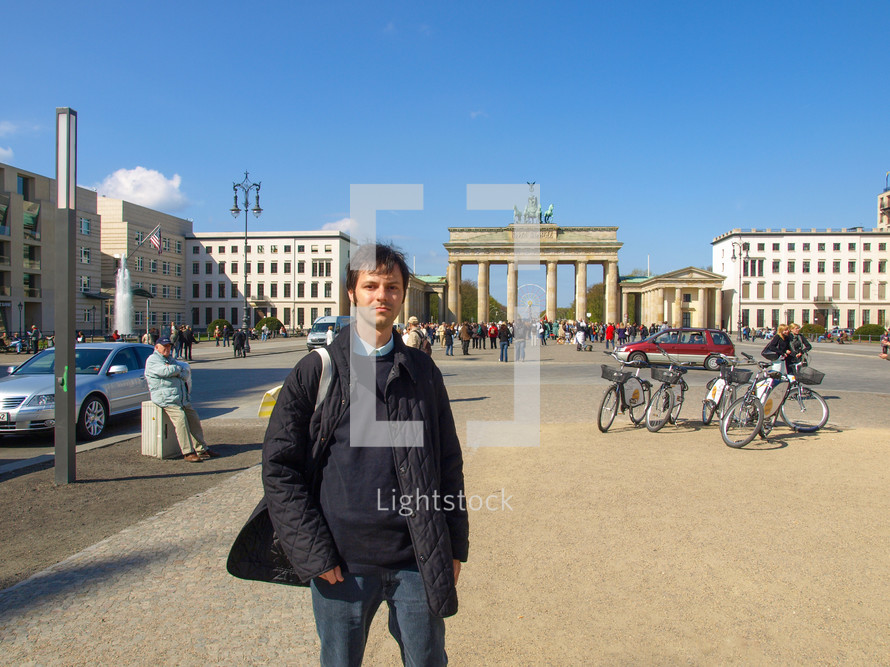 BERLIN, GERMANY - APRIL 23, 2010: Tourist in Pariser Platz in front of the Brandenburg Gate