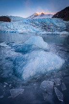 Frozen lake and icebergs in front of Mendenhall Glacier in Juneau, Alaska.