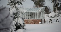 a greenhouse in winter snow 
