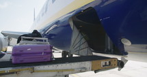 Offloading of luggage from airplane at the airport