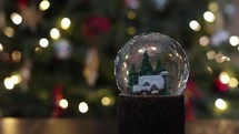 Christmas snow globe with "snow" settling