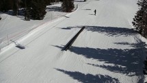 snow boarding down a ski slope 