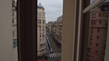 Timelapse of traffic in Parisian street, view through window