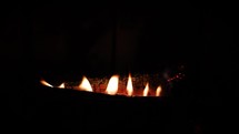 Six Flames in a Row on a Log in the Hearth