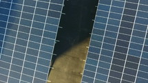 Aerial lift of solar panels over a parking lot
