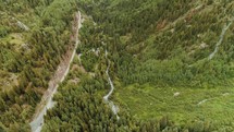 aerial view over green mountain forest 