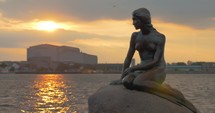 The Little Mermaid statue at sunset