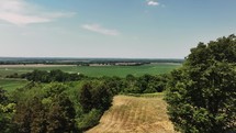 Aerial landscape footage of the countryside revealing vineyards and crop fields.