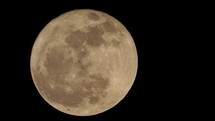 red supermoon large full moon seen with telescope
