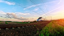 High-speed bullet train. Electric locomotive with railway cars on the railway. Modern intercity passenger train. Railroad in europe.