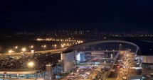 Timelapse of busy car traffic in night illuminated city
