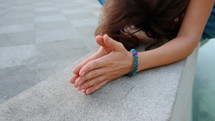 Woman hands together in prayer and gratitude. 