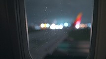 Rainy window on airplane