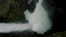 Powerful Pailon Del Diablo Waterfall In Baños de Agua Santa, Ecuador - drone descending	