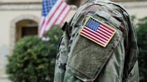 General Instills Valor In American Serviceman With Flag For His Service