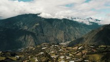 Runtun Area With Tungurahua Volcano In The Background In Baños de Agua Santa, Ecuador - drone shot	
