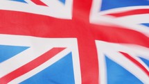 national flag of the United Kingdom (UK) aka Union Jack waving in the wind