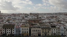 Flyover traditional Seville neighborhood toward St. Anne church in Triana District. Andalusia