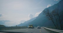 driving through the italian alps in a car