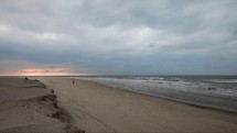 Cloudy sunset on the beach of Langeoog Island, Germany - static shot