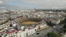 Emblematic and iconic Maestranza bullring in Seville, Spain; aerial pan