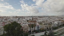 Aerial panoramic view of Triana famous touristic neighborhood with Santa Ana parish in background, Seville in Spain