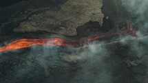 Drone aerial view of lava flowing from Pacaya volcano eruption in Guatemala.	