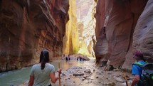 Slot Canyon with Adventurous Person Hiking in Zions National Park, Utah
