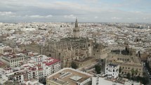 Seville Cathedral and cityscape, Spain. Aerial orbiting