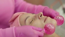 Application of roller tool on patient face, Facial massage on patient skin, using tool skin care
