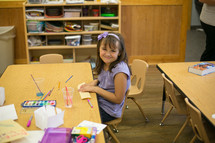 smiling girl watercoloring in children's church