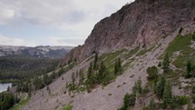 Drone footage of the side of a rocky mountain