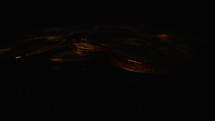 Ethereum coins lie densely on a black background and the lights flash quickly