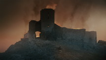 Fortress burning at sunset after medieval battle. 
