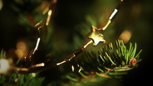 Christmas star toys rotating on blinking bokeh background.

